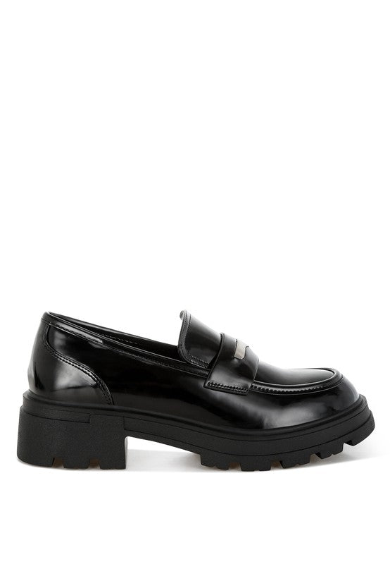 Medial side view of Black Gleam Stride Chunky Loafers showing cushioned insole and block heel.