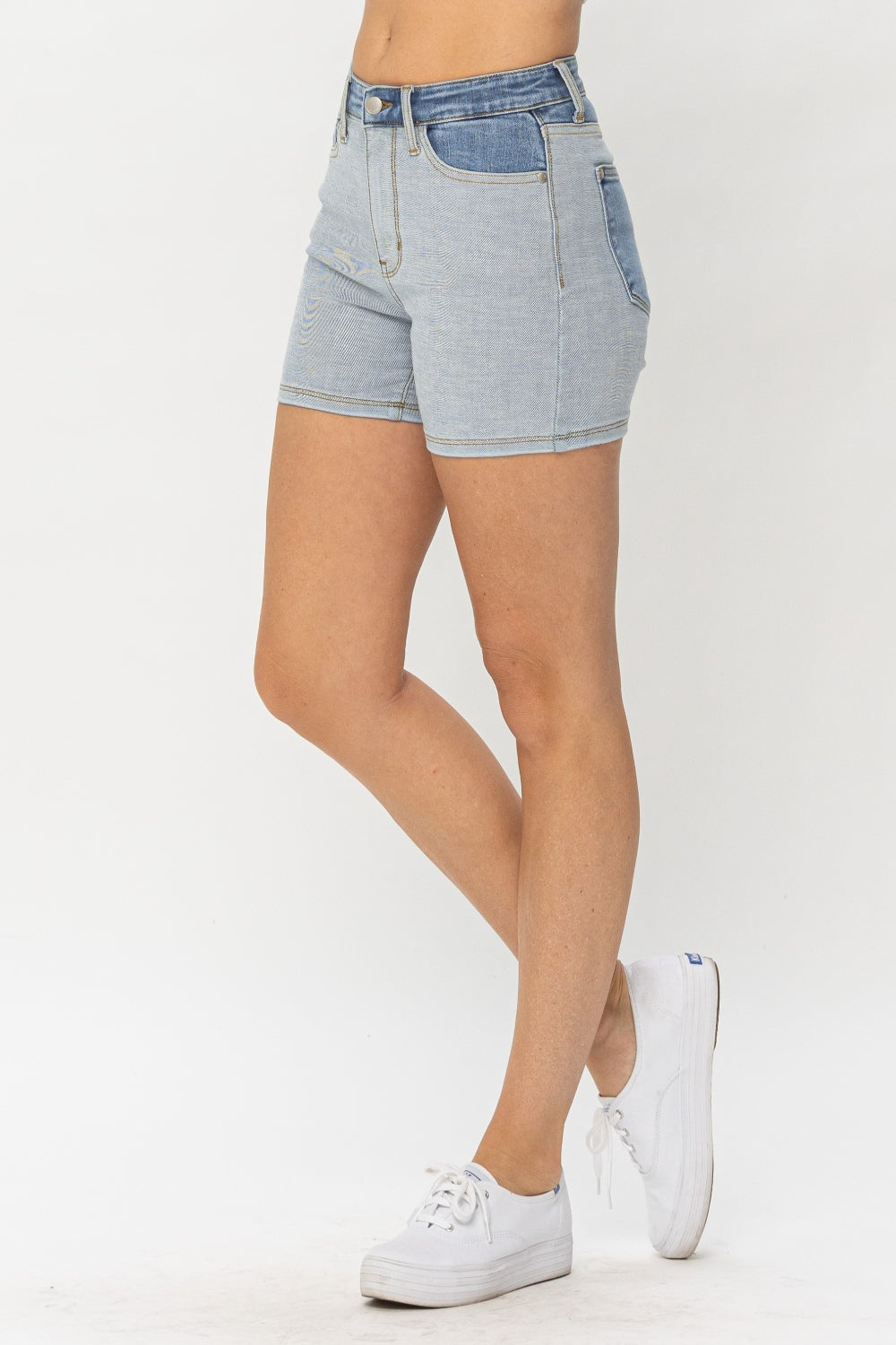 Left side view of Zara Color Block Denim Shorts by Judy Blue with contrasting light and dark denim.