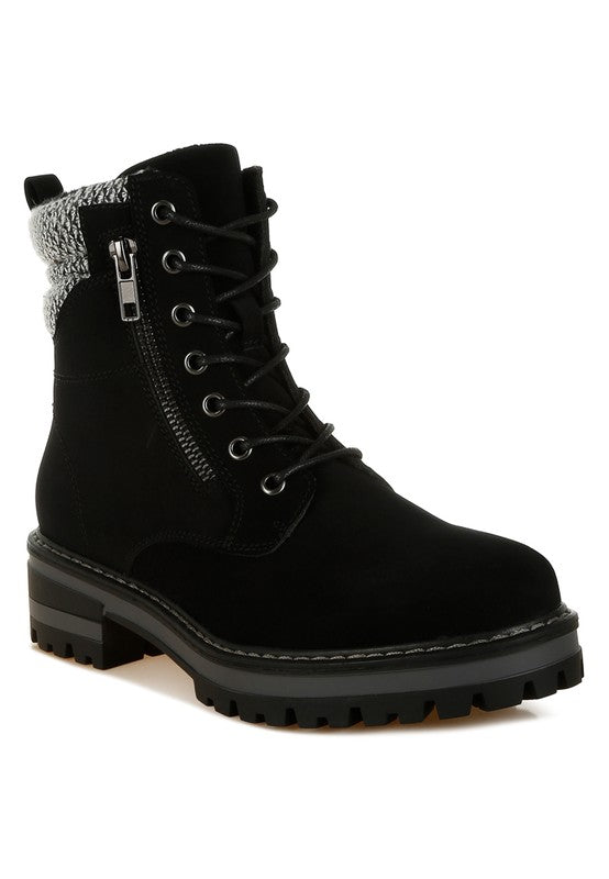 Front angle of Black Mahisha Hiker Boots with lace-up design, knitted collar, and dual zipper details.