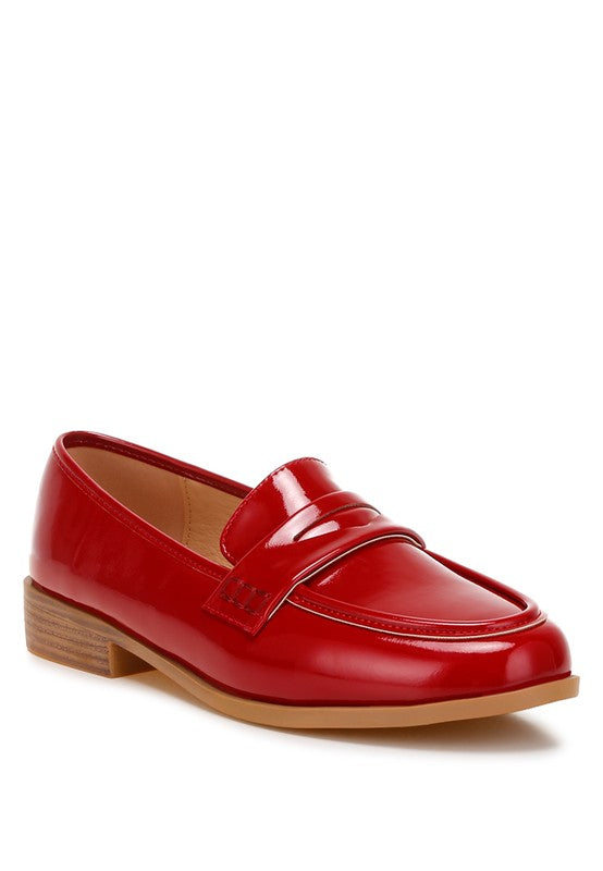 Front angle of Red Avery Patent Loafers with glossy finish, penny strap, and round toe.