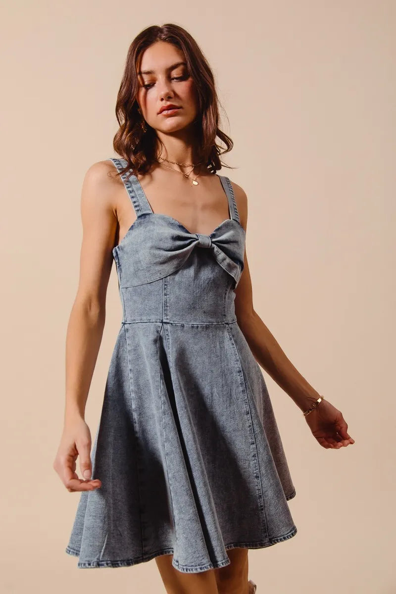 Profile view of Cassidy dress emphasizing the bow ribbon from the side and feminine silhouette.