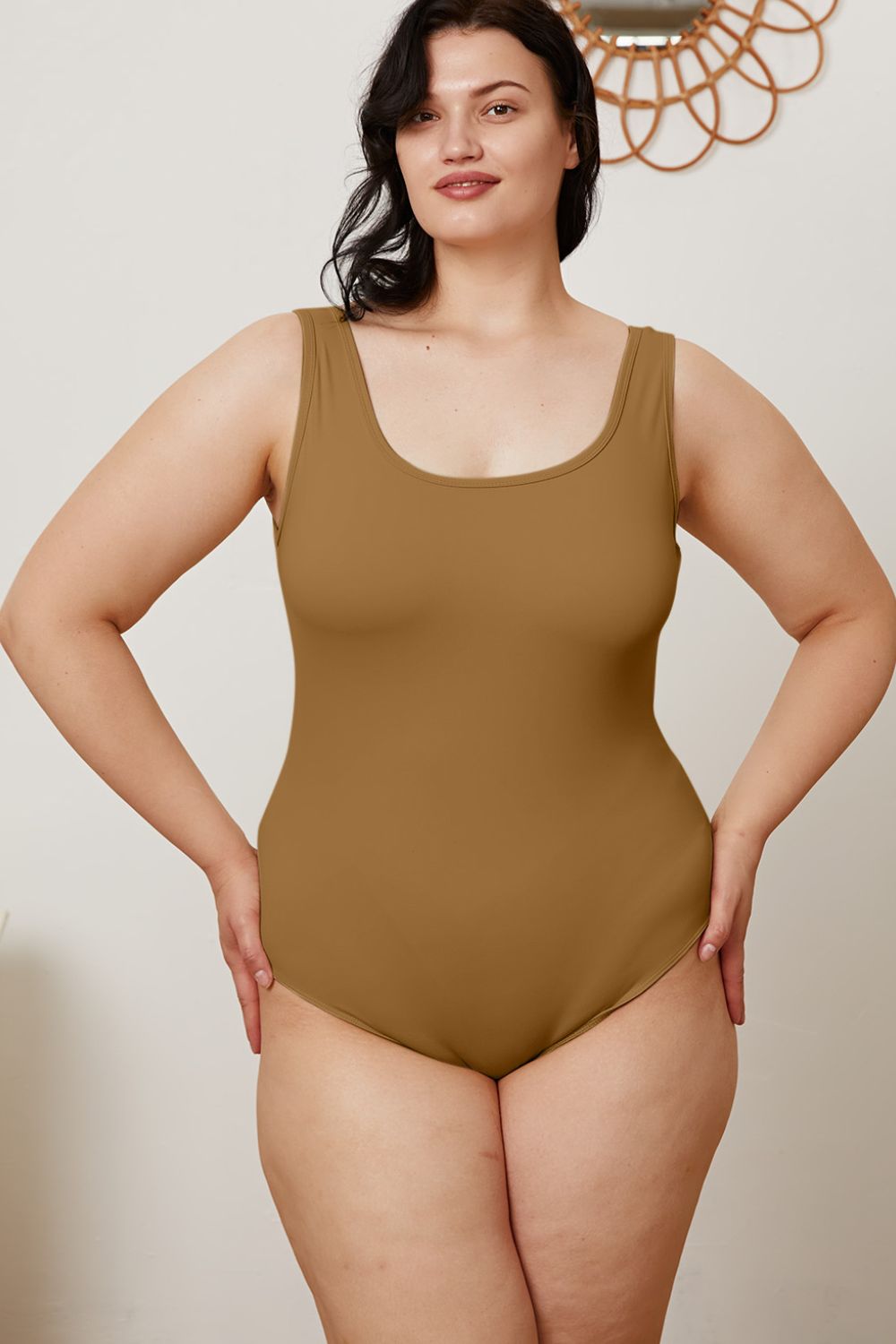 Plus size model in Sarah Camel Bodysuit showing square neckline and flattering fit.