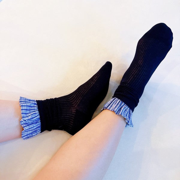 Woman wearing blue Oh So Chic Plaid Ruffle Socks showing ruffle trim detail.