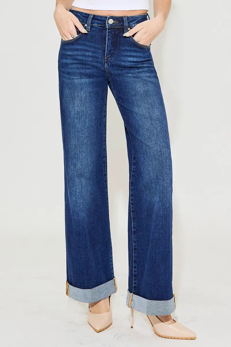 Christina Wide Leg Jeans in dark wash denim, high rise waist, wide leg silhouette, cuffed hem detail.
