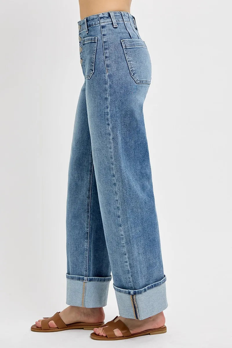 Side view of RISEN Asher high rise wide leg jeans with cuffed hem, front patch pocket, and flattering relaxed fit in medium wash