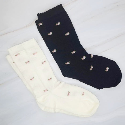 Flat lay of black and white Vintage Floral Patterned Socks set side by side.