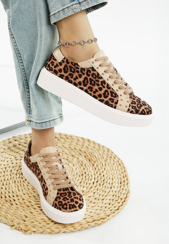 Front view of beige leopard print studded chunky sneakers with lace-up closure and flatform sole.
