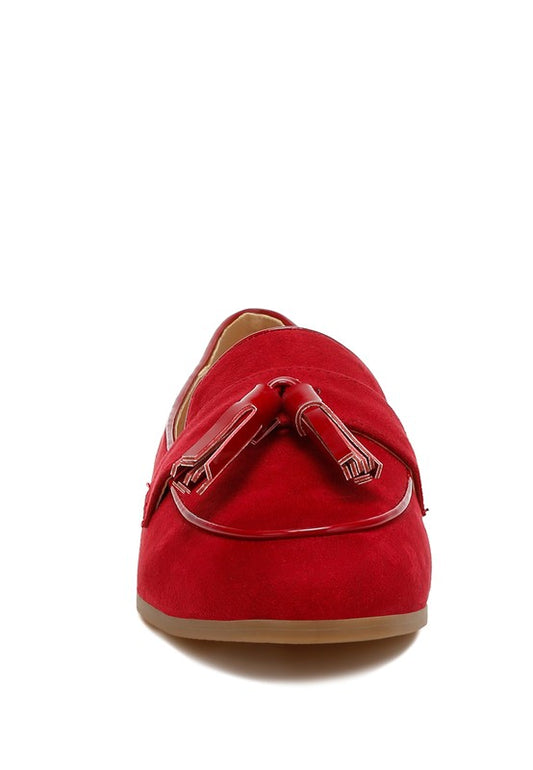 Red suede tassel loafers front view with almond toe and classic style.