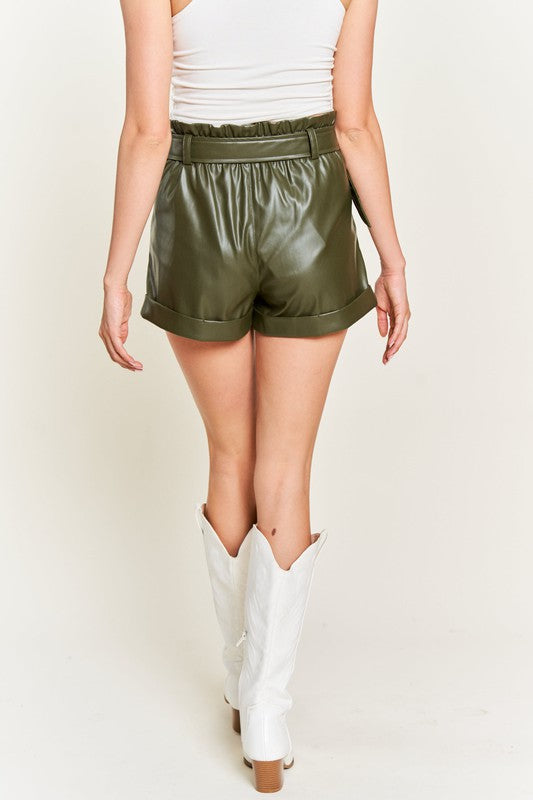 Back view of Larissa high-rise faux leather shorts with tailored seams and smooth olive finish.