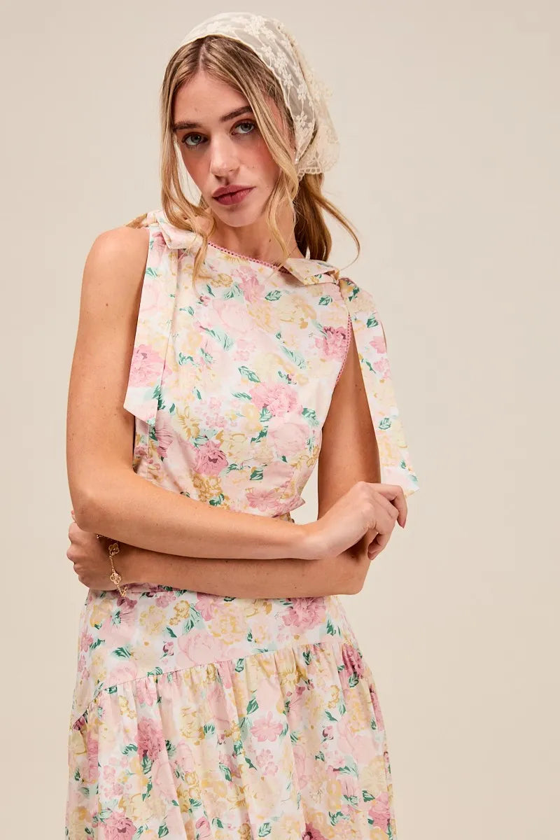 Close-up of Soraya Floral Two-Piece Set showing pink floral pattern and bow-tie shoulder straps on the crop top.