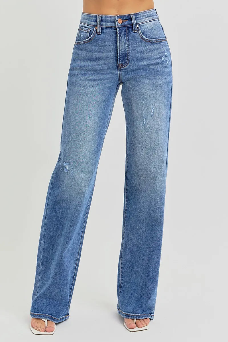 Casual pose in front-facing angle of Allyson jeans, featuring subtle cat's whisker distressing.