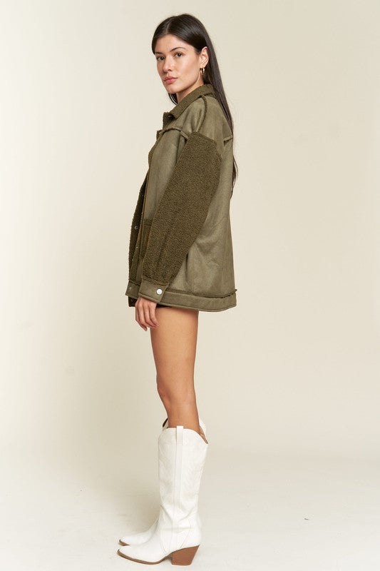 Olive Galina faux suede sherpa jacket side view highlighting sherpa sleeve detail.