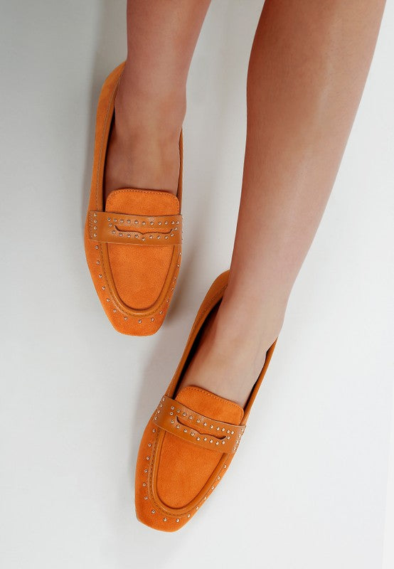 Top view of woman wearing Tan Lumina Penny Strap Studded Loafers with cushioned insole comfort.