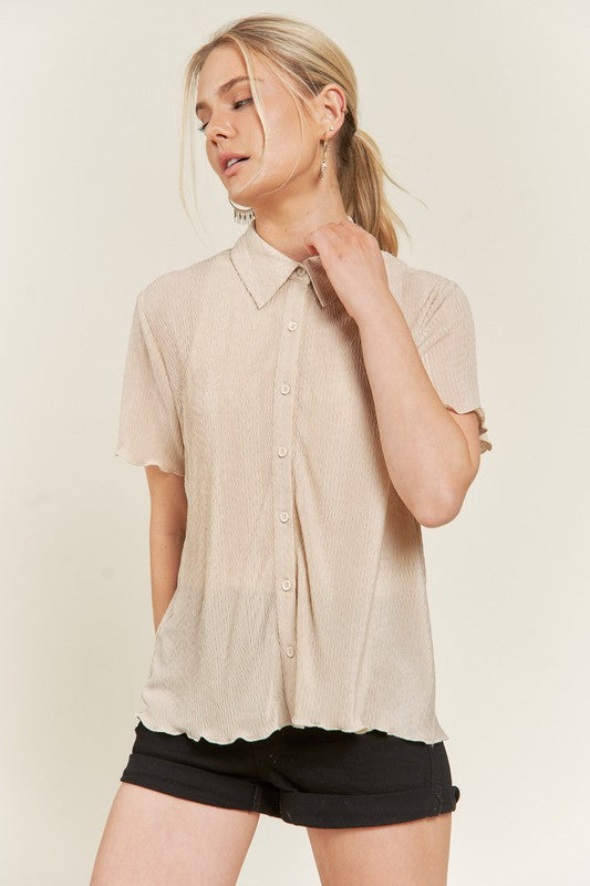 Taupe collared shirt fabric with textured finish detail.