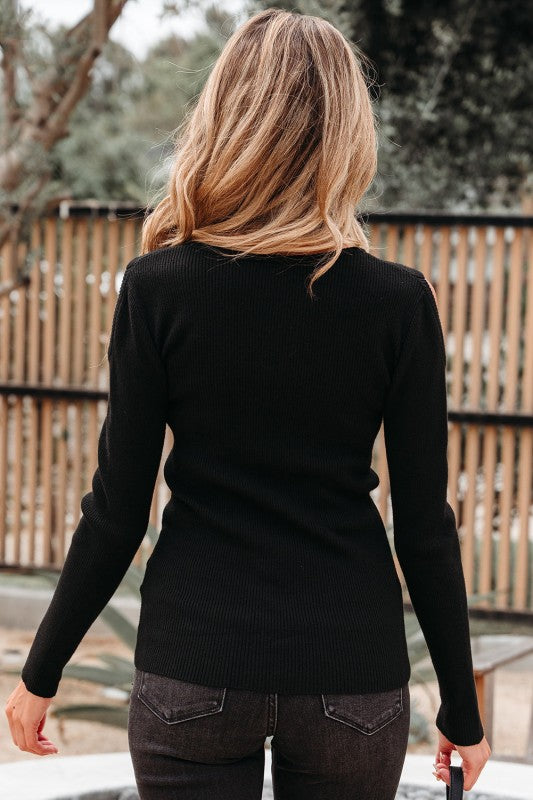Back view of Amaya Ribbed Knit Cold Shoulder Sweater in ribbed fabric.