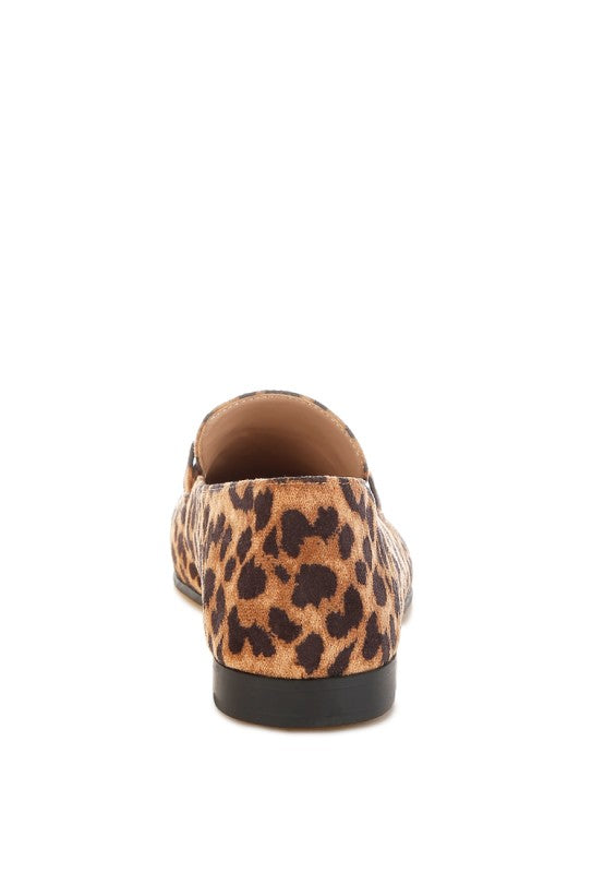 Heel view of microfiber leopard loafers with flat heel and rubber sole.