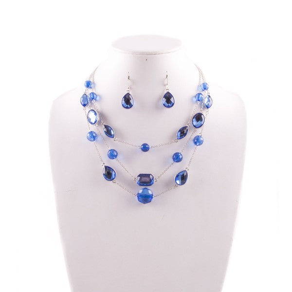 Blue Gem Layered Necklace and Earrings Set in silver tone with triple-tier waterfall design and matching drop earrings on display.