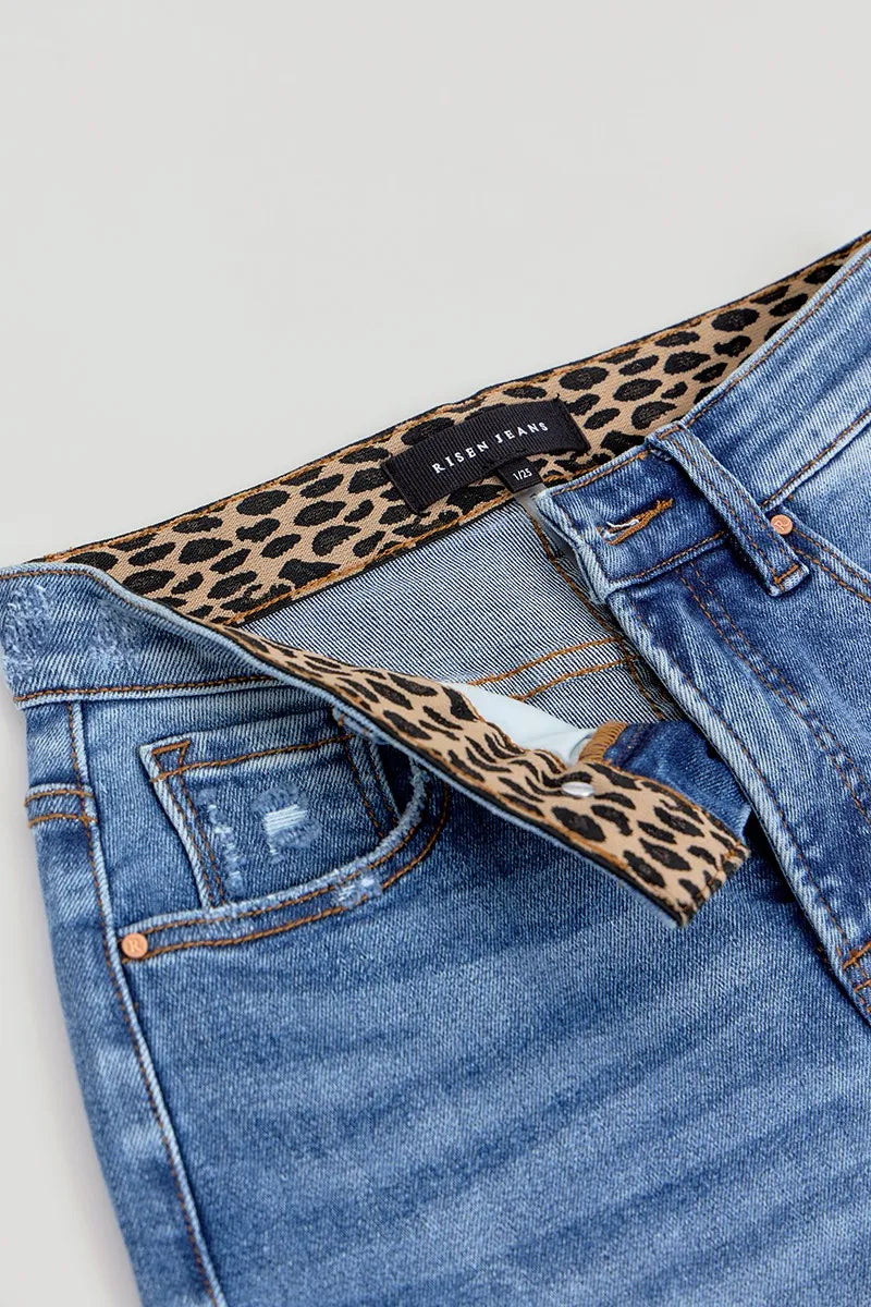 Close-up flat lay of the Allyson wide leg jeans, highlighting the inner waistband with a bold leopard print lining and tummy control band detail.