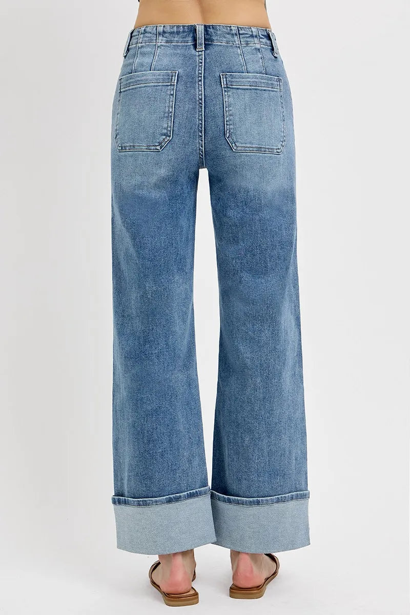 Back view of RISEN Asher high rise wide leg jeans featuring clean back design, relaxed fit, and cuffed hem in medium wash denim