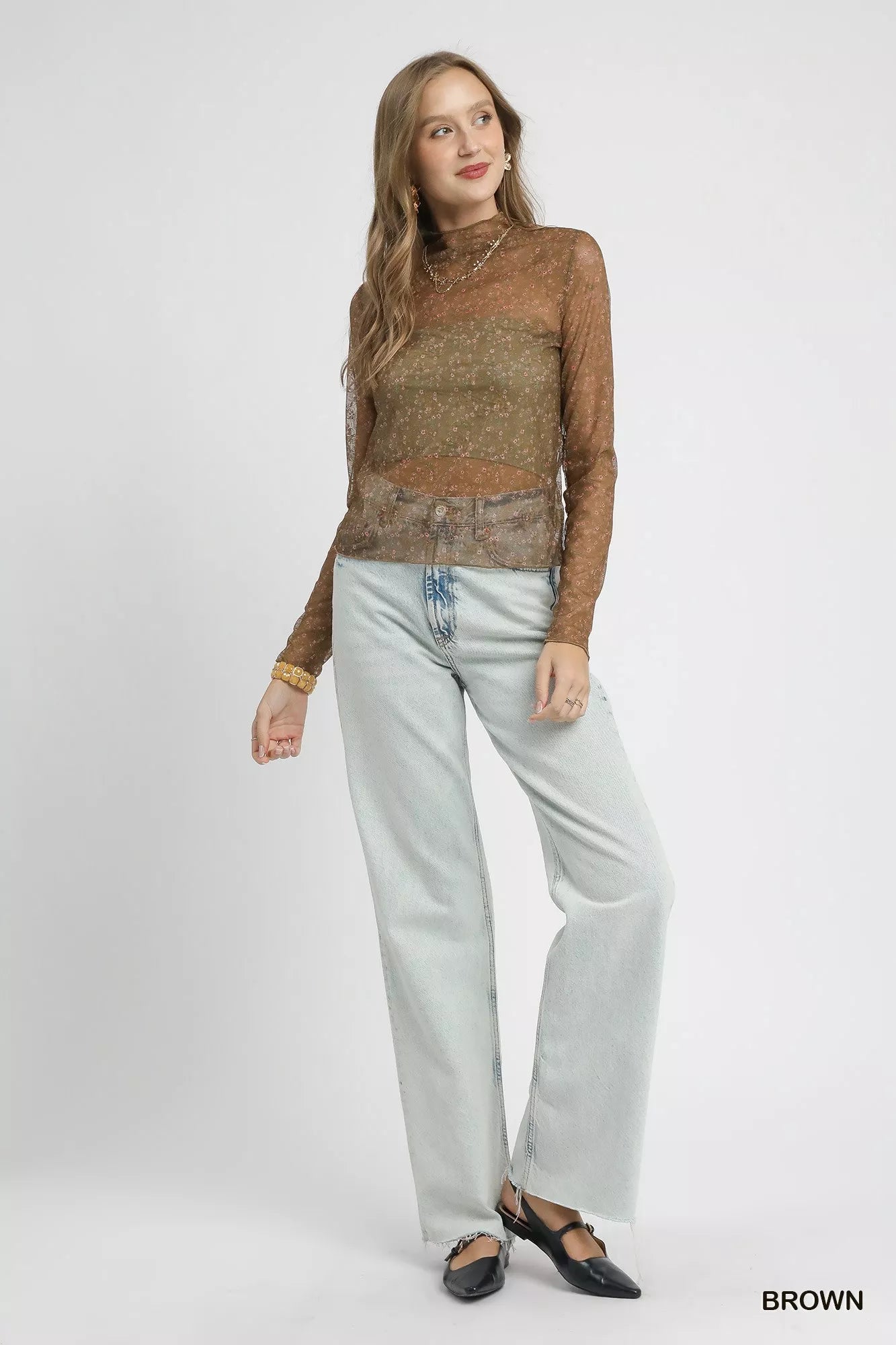 Elegant brown lace mesh blouse front angle, mock neck and sheer sleeves.