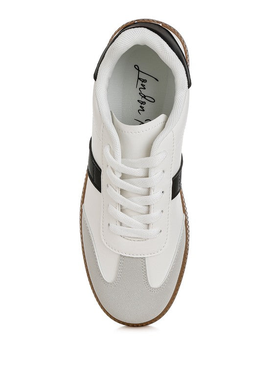 Top view Joelle white crossover sneakers with round toe and contrasting sole.