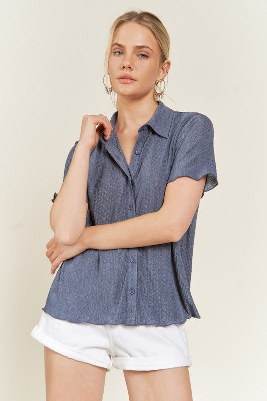 Short sleeve denim blue textured button down shirt, flattering cut.