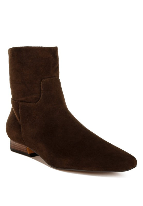 Front angle view of the Hakra suede boot in brown, showcasing the closed almond toe and flared block heel.