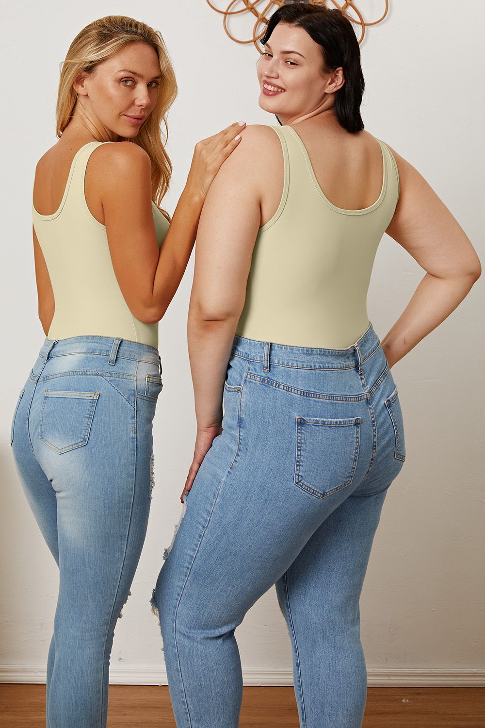 Back view of two models in Sarah Beige Bodysuit, showcasing flattering fit on different sizes.