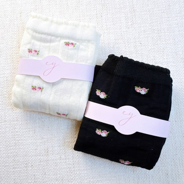 Folded black and white Vintage Floral Socks set stacked together.