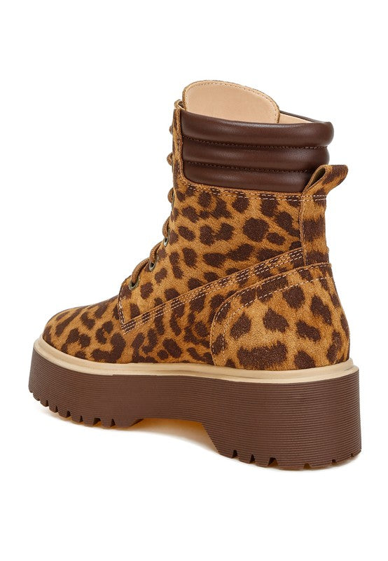 Back angle of Ujola High Ankle Leopard Real Suede Leather Boots showing quilted collar, pull tab, and rugged lug outsole.