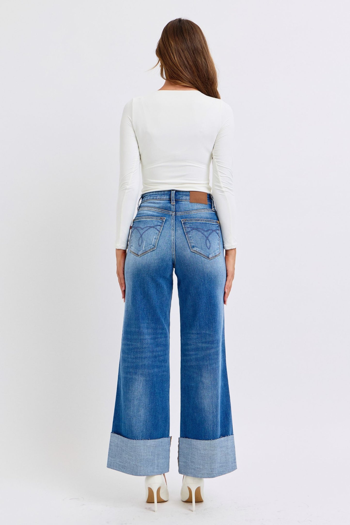 Full body back view of Nare Plus Size Wide Leg Jeans with back pockets and distressed design.