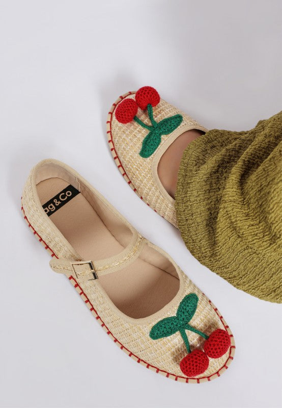 Top view of beige Brunch Date Mary Jane Flats highlighting woven texture, cherry detail, and round toe design.