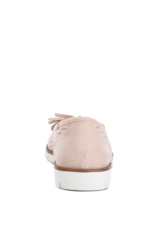 Back view of blush Pacer vegan leather ballerina flat displaying the flat heel and smooth vegan leather finish.