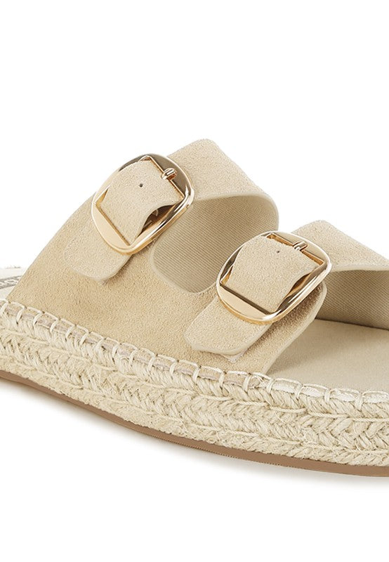Close-up of beige genuine leather espadrille flatform sandal showing buckle strap detail and espadrille-wrapped heel.