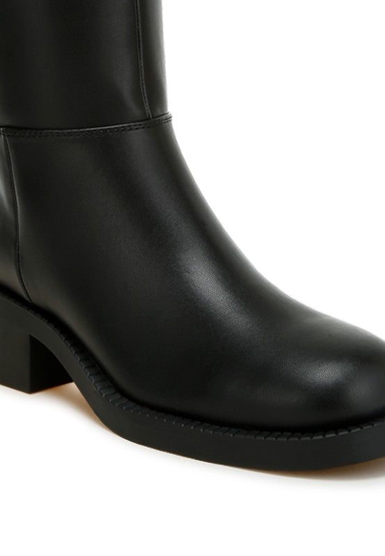 Close up of Soora Block Heel Calf Boots in black showing paneling and heel detail