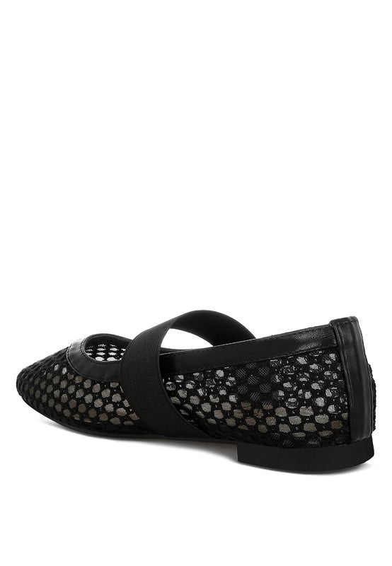 Inside side angle of Black Nayela Flats with strap and flat heel design.