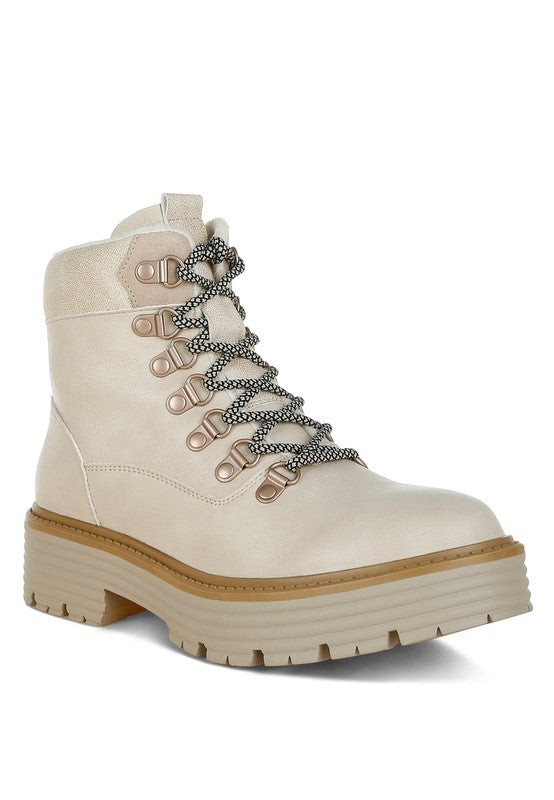 Front angle of Beige Boskoff Lace-Up Chunky Ankle Boots with lace-up front, block heel, and lug sole.