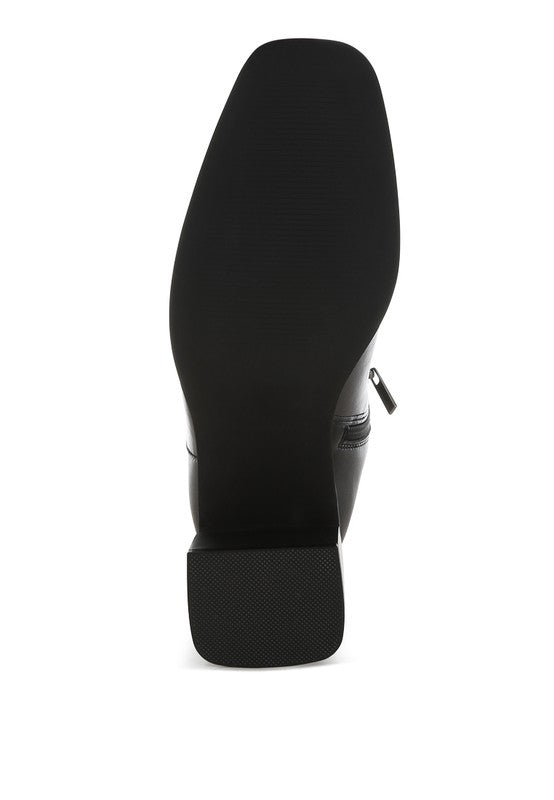 Bottom view of Black Muskox Square Toe Boots with durable TPR sole and block heel support.