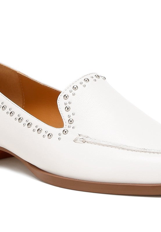Close up of white Wolferton loafers with stud detailing and almond toe