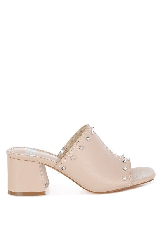 Rag Company Lomela Mules in beige with stud detailing, open square toe design, slip-on style, and a 2.5-inch block heel, crafted from genuine soft leather.