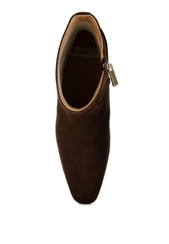 Top view of the Hakra suede bootie in brown, highlighting the closed almond toe and soft suede texture.