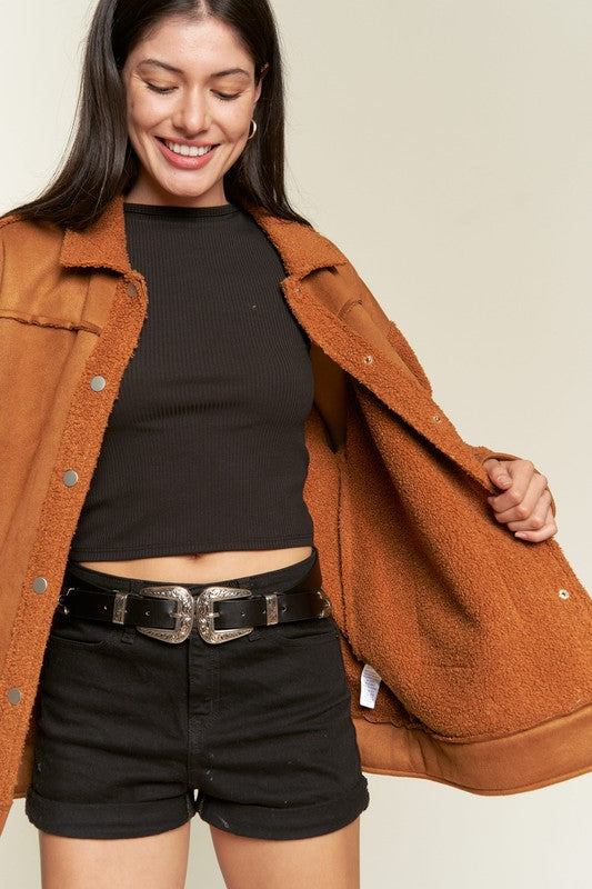 Close-up of camel Galina faux suede sherpa jacket showing sherpa collar and snaps.