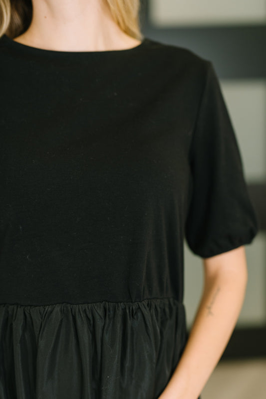 Close up of Adele Contrast Midi Black Dress stretchy jersey bodice detail.