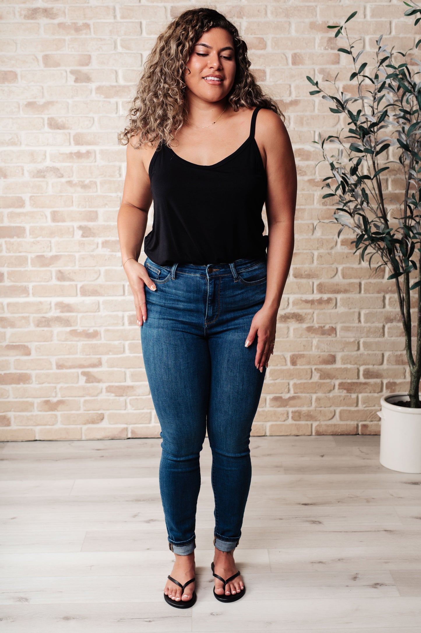 High-stretch plus size jersey tank for women β fashion-forward black sleeveless top.