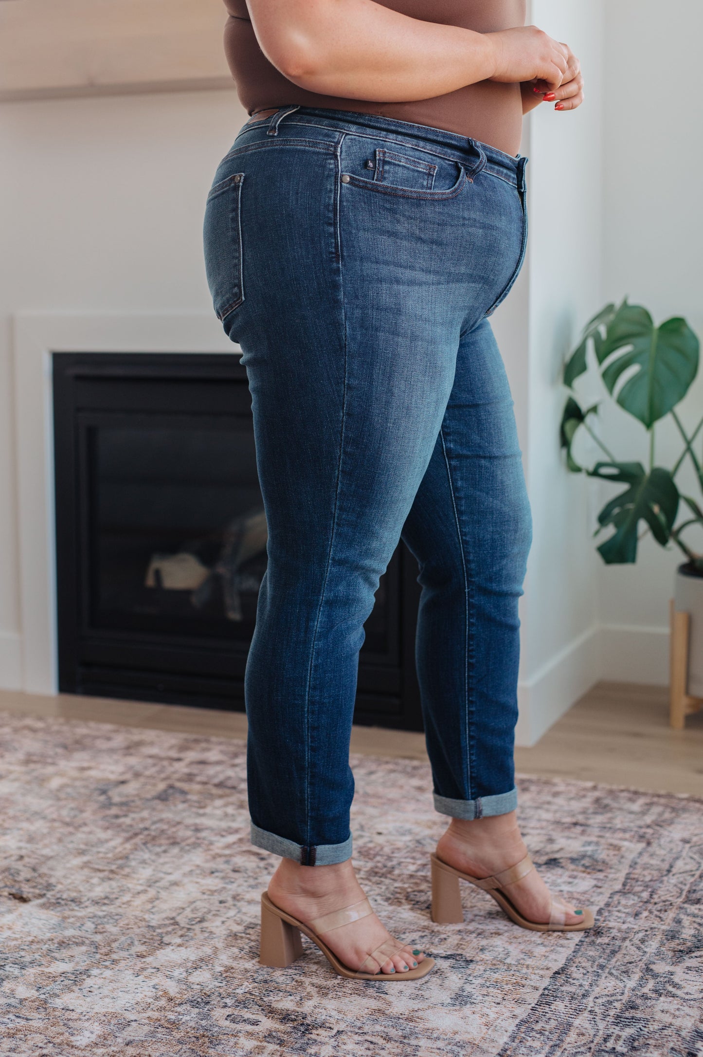 Side view of the Judy Blue plus size Amber cuffed slim fit dark wash jeans – mid-rise stretch.