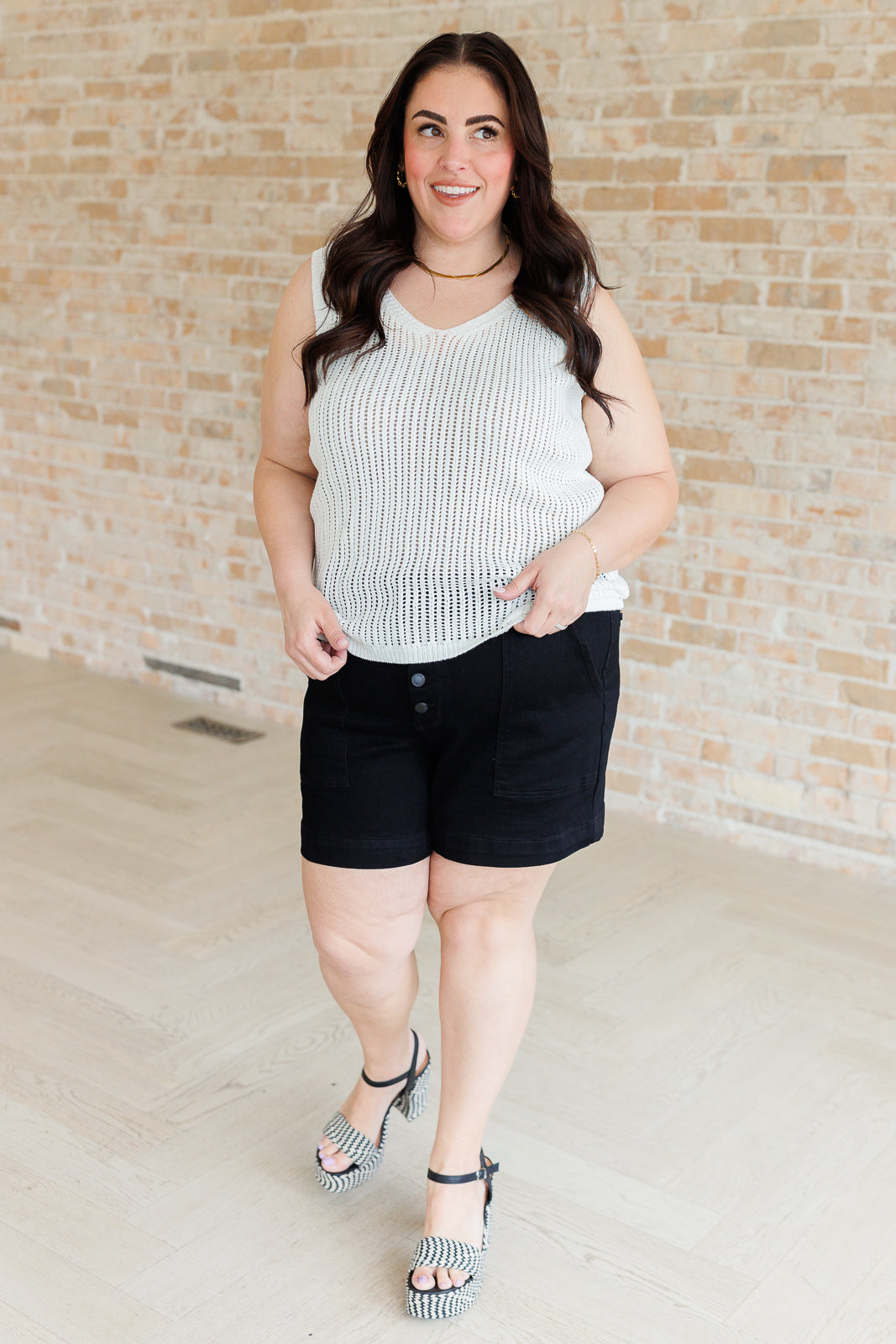 Lightweight plus size sleeveless sweater tank in open knit acrylic.