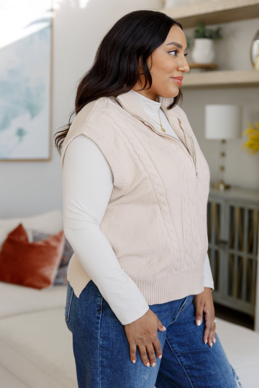 Side view of plus size ivory Ashton Cable Knit Vest with ribbed neckline and cable knit texture.