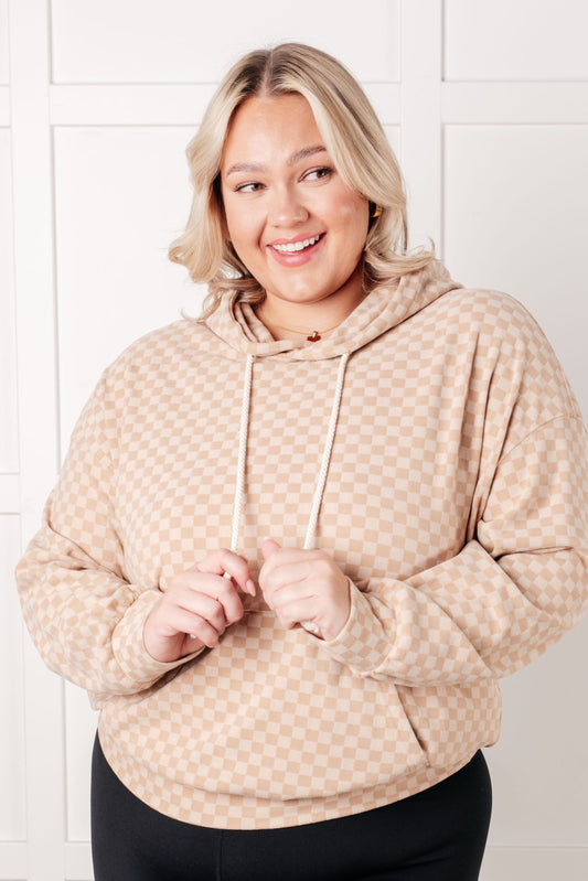 Plus size front view of Dalia Checkered Hoodie in khaki with kangaroo pocket and cozy fleece texture.