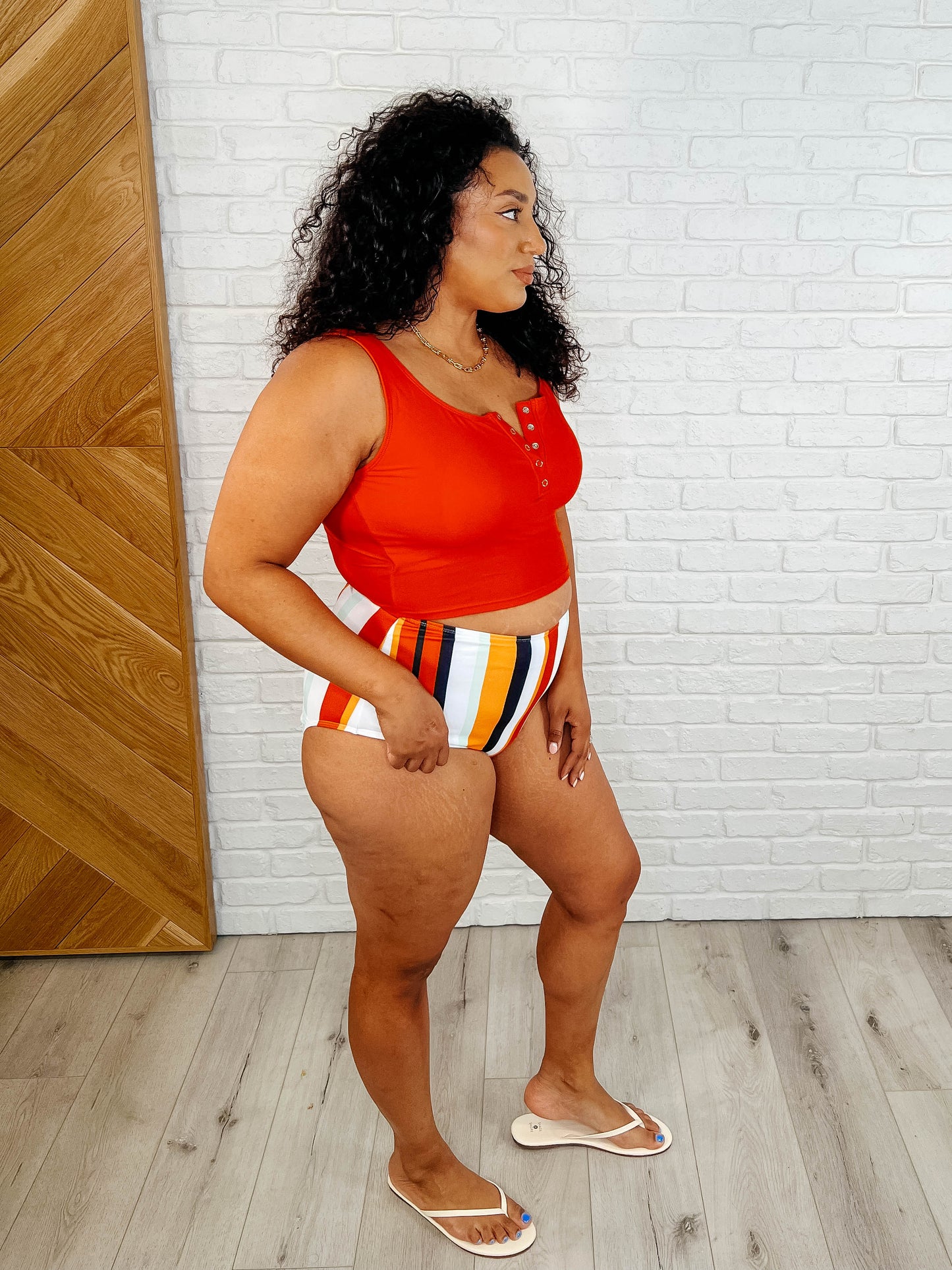 Striped Bermuda High Waist Swim Bottoms with a cheeky fit, fully lined interior, and vibrant red, white, yellow, and black color combination for a bold look.