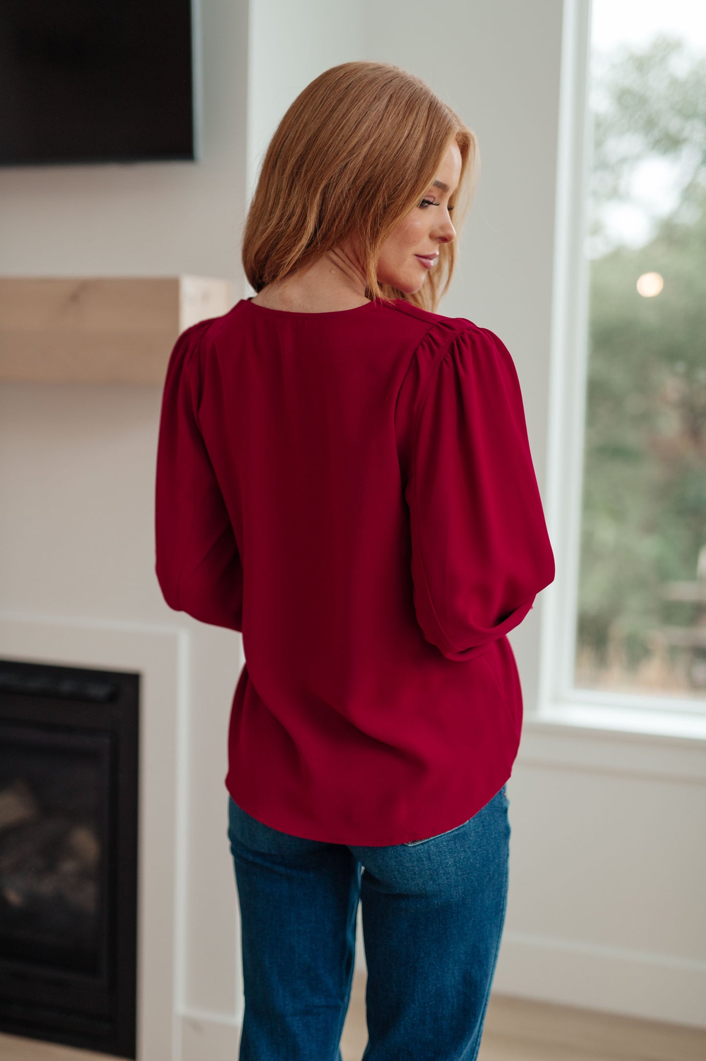 Back view of Birdie V-Neck Blouse, deep wine with gathered puff sleeves.
